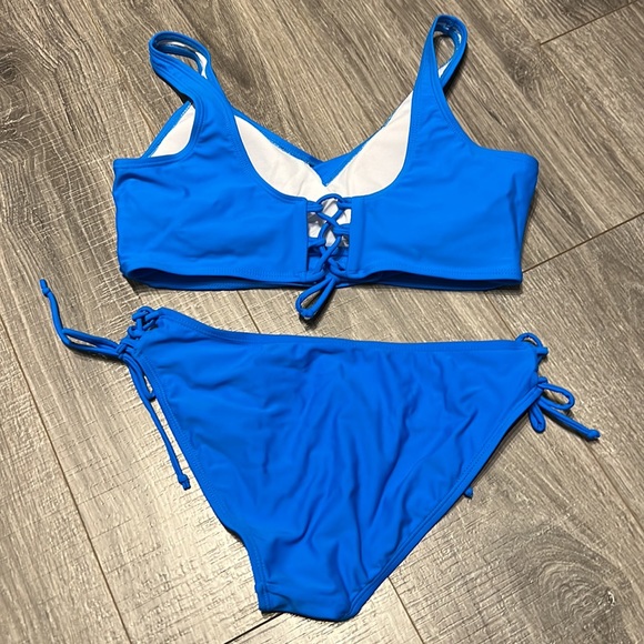 NWOT! Women’s size medium swimsuit ! Blue ties on back and sizes! - Picture 2 of 2